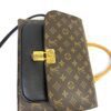 Angled view of the black flap and gold lock