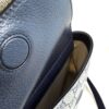 Embossed GG on the navy leather flap seen from the side