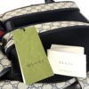 Backpack shown with the Gucci tag and care booklet