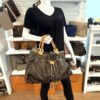 Irene carried on the arm by a mannequin in the boutique