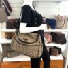Diaper bag carried by a mannequin in the boutique