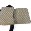 Flap opened flat showing the front pocket and canvas back
