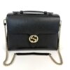 Gucci Interlocking G shoulder bag in black leather with gold GG closure and chain strap
