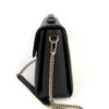 Side view with the chain strap hanging down