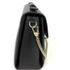 Side of the bag with the gold clip and chain ring