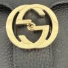 Close up of the gold interlocking G closure