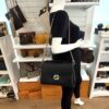 Interlocking G bag worn crossbody by a mannequin in the boutique