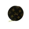 Front of the round purse with the zip pull at the base