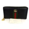 Wallet shown with its Gucci care card