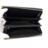 Interior opened by a gloved hand showing the card slots
