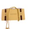Chain and pendant arranged across the branded gift box