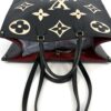 Top of the tote with the handles laid forward