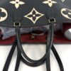 Top of the tote with the handles and shoulder straps