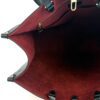 Interior burgundy suede with the gold clip