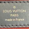 Leather tag reading LOUIS VUITTON PARIS made in France