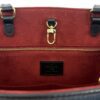 Interior zip pocket and leather tag on the suede