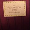 Leather tag reading LOUIS VUITTON PARIS made in France