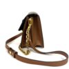 Side view with the strap hanging beside the bag