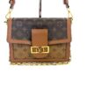 Front of the bag with the chain and leather strap