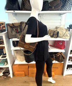 Dauphine MM carried by a mannequin in the boutique