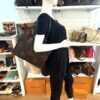 Mannequin holding the tote by its leather handles