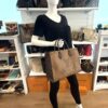 Onthego MM carried by a mannequin in the boutique