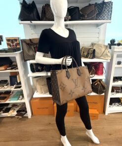 Onthego MM carried by a mannequin in the boutique
