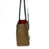 Side of the tote with the red interior showing