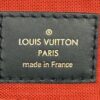 Leather tag reading LOUIS VUITTON PARIS made in France