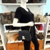 Marceau bag worn on the shoulder by a mannequin in the boutique