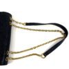 Full strap laid out beside the bag