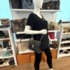 Mannequin holding the bag with the chain strap