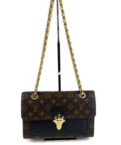 Louis Vuitton Victoire shoulder bag in Monogram canvas and black leather with gold S-lock