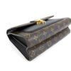 Angled top view of the monogram canvas flap