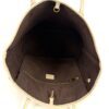Tote held open showing the full brown interior