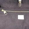 Interior zip pocket set into the brown lining