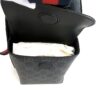 Flap lifted to show the insulated bottle pocket inside