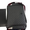 Bag standing on end with the strap draped over the top