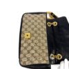Bag opened to show the lining and hardware