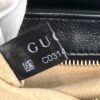 Interior Gucci tag showing the reference number