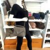 College bag worn crossbody on a mannequin in the boutique
