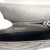 SAINT LAURENT PARIS stamped above the interior zip pocket