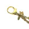 Charm laid flat showing the clasp, chain and pendants