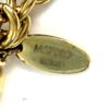 Reference M67930 stamped on the oval gold tag