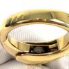 Close up of the polished gold clasp in a gloved hand