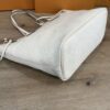 Side of the tote with the embossed monogram