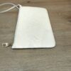 Angled view of the pouch and strap