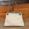 Back of the tote hanging with both chain straps up