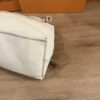 Base corner showing the pebbled leather and side seam