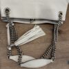 Top view of the chain straps, tassel and leather shoulder pad